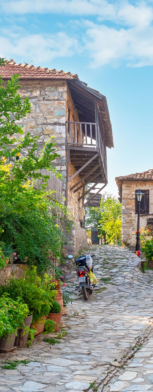 Picturesque stone village street with cafes