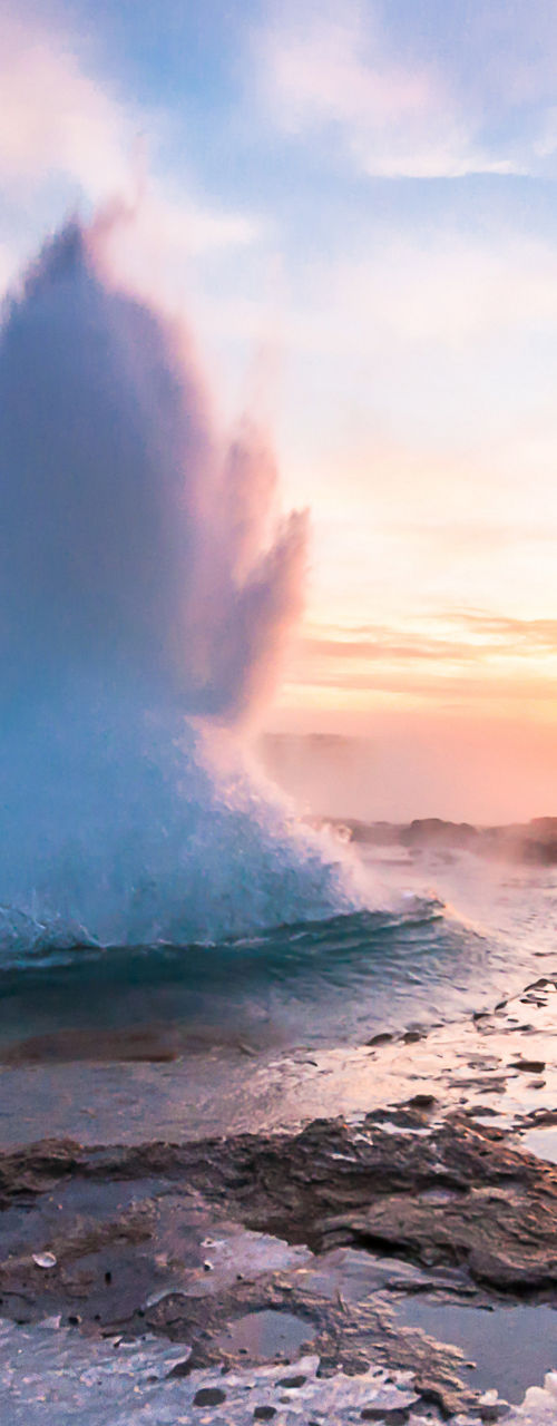 Geyser eruption at sunrise in Iceland