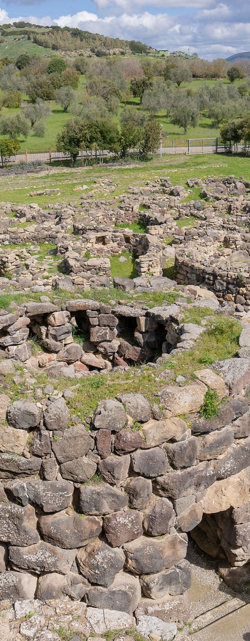 Ancient stone ruins in lush landscape