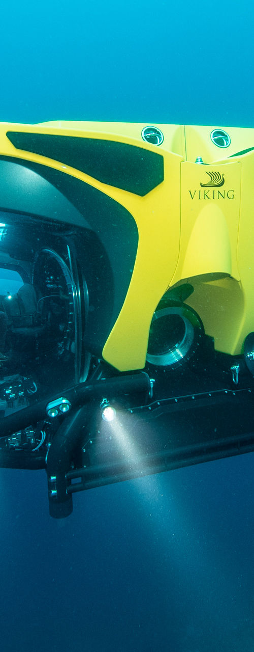 Yellow underwater drone exploring deep ocean