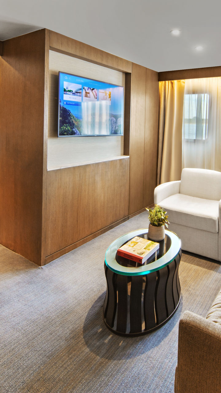 Modern hotel suite with cozy seating area