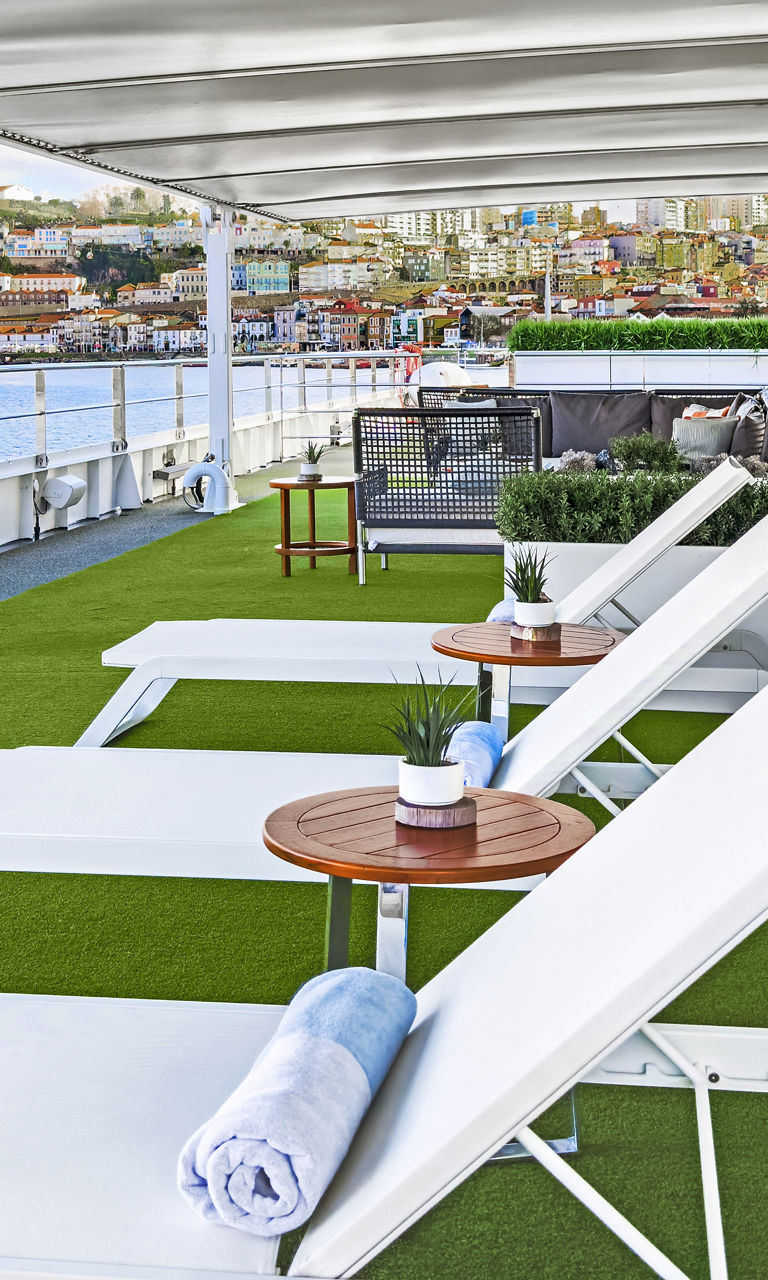 Riverside sun deck with lounge chairs
