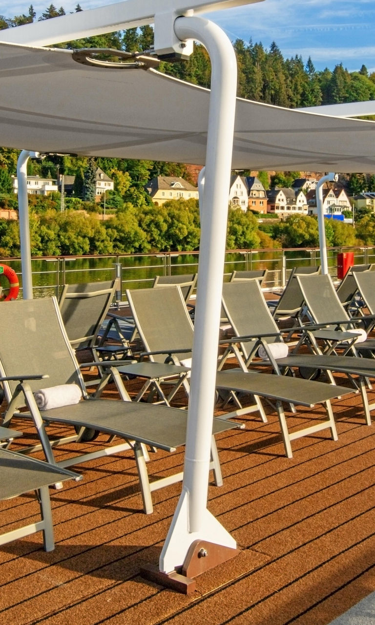 Outdoor deck with lounge chairs and canopy