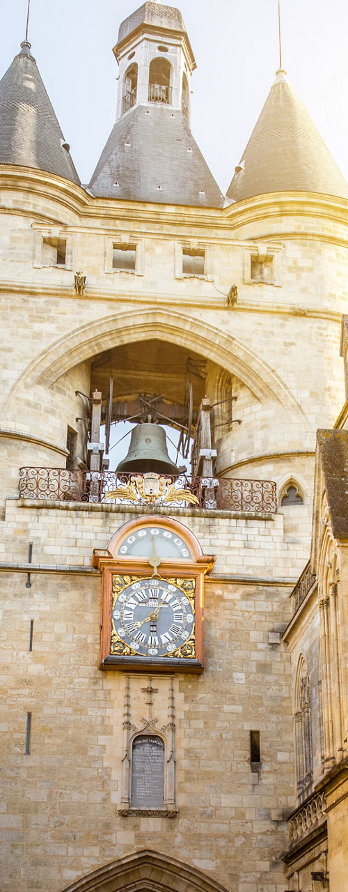 Historic Clock Tower in Sunlit Street