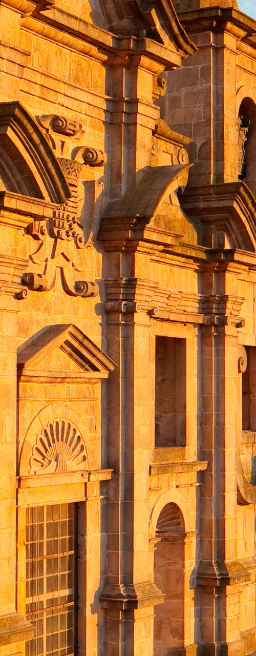 Historic church overlooking city at sunset