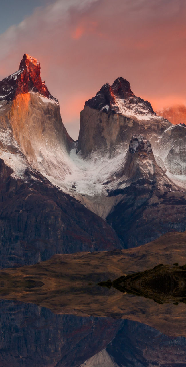 Majestic mountain peaks at sunset reflection
