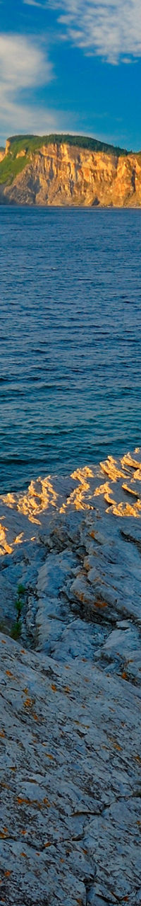 Coastal cliffs with ocean view at sunset