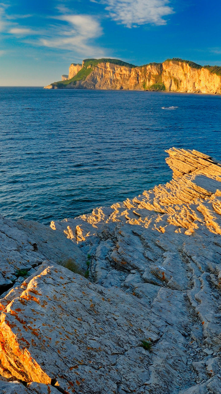 Coastal cliffs with ocean view at sunset