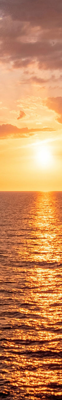 Serene ocean sunset with vibrant clouds
