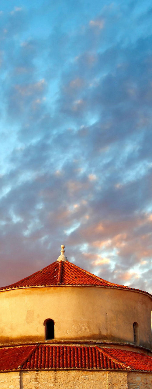 Historic church with bell tower at sunset