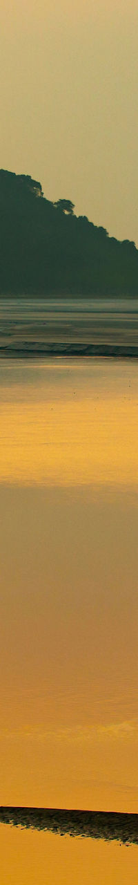 Serene river at sunset with lone boat