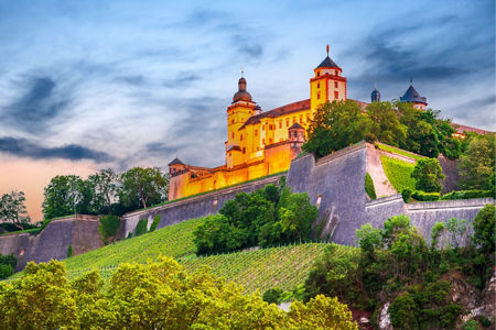 Historic castle overlooking lush vineyards