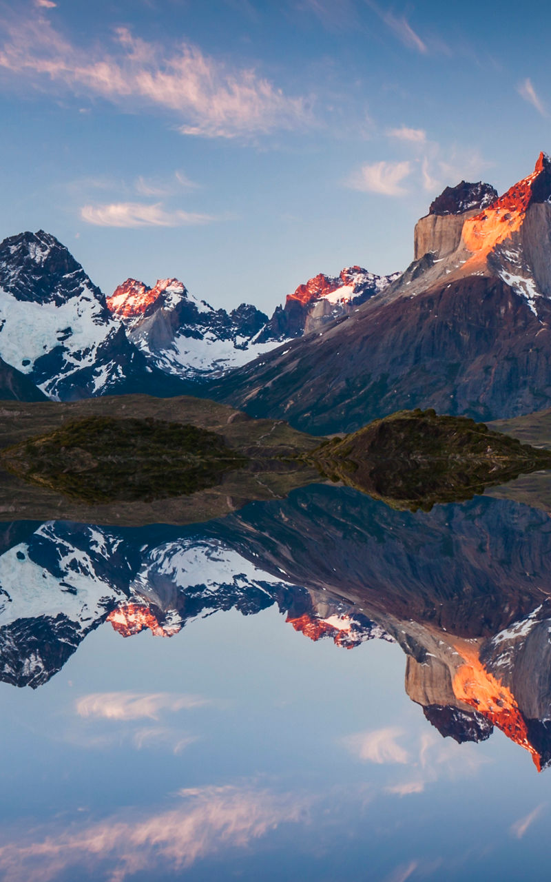 Majestic mountain range reflected in calm water