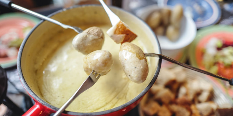 Cheese fondue with potatoes and bread