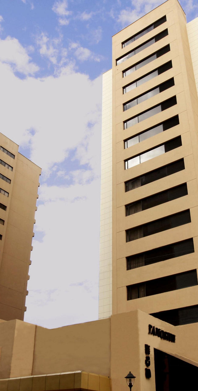 Modern hotel building with flags displayed