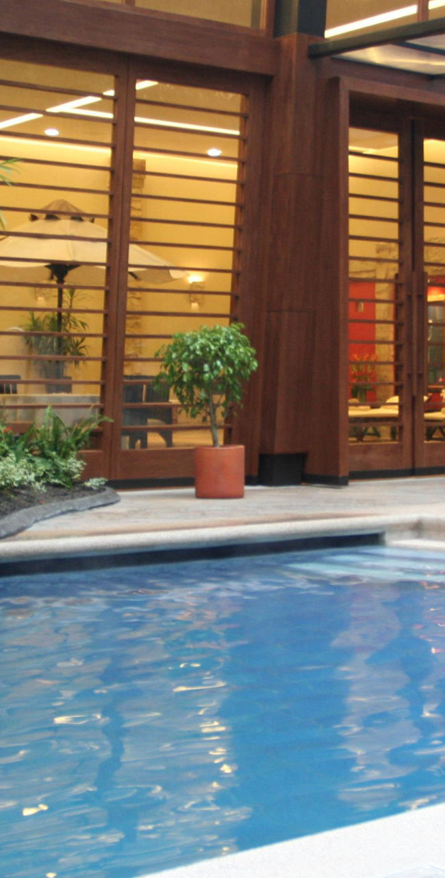 Modern indoor pool with waterfall feature
