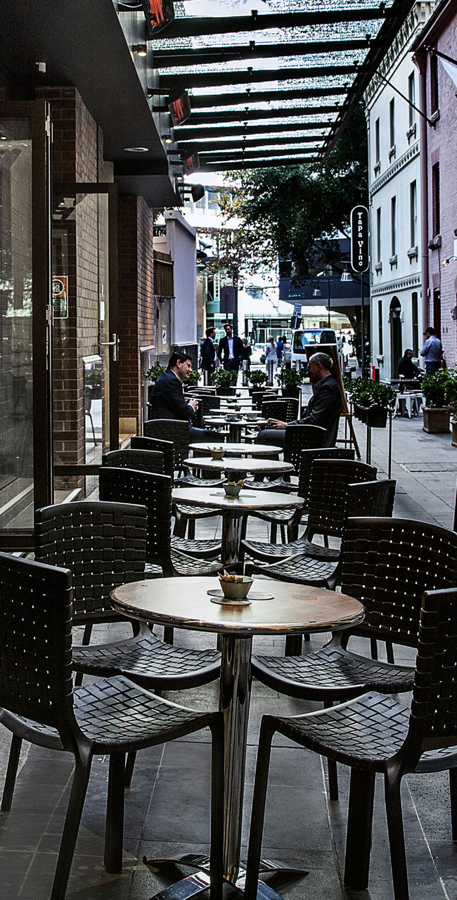 Outdoor café seating in urban alleyway