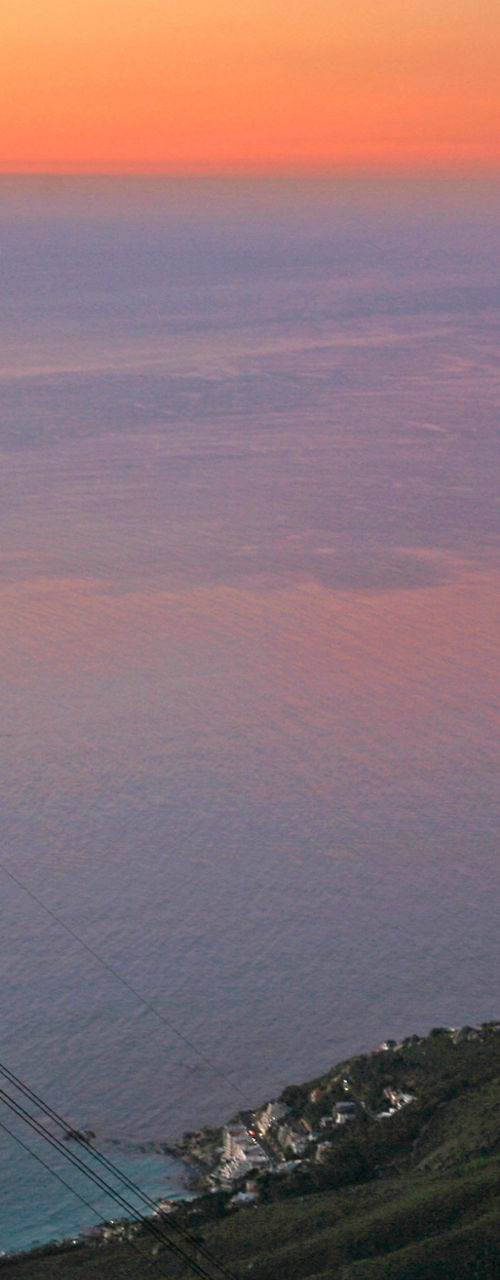 Cable car at sunset over mountain landscape