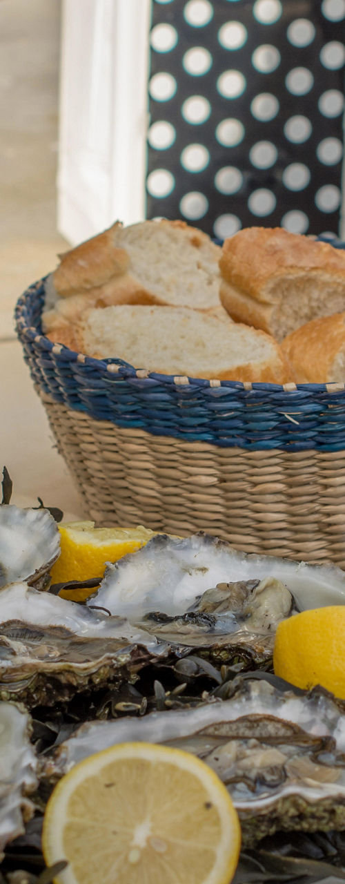 Fresh oysters with wine and bread outdoors