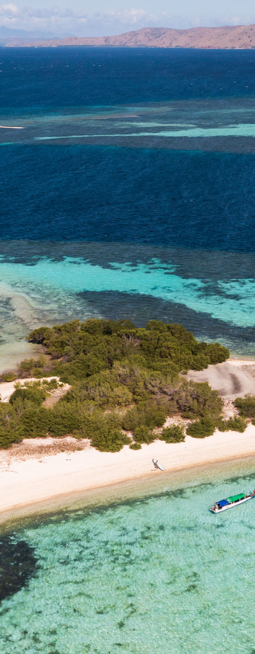 Aerial view of tropical island and coral reef