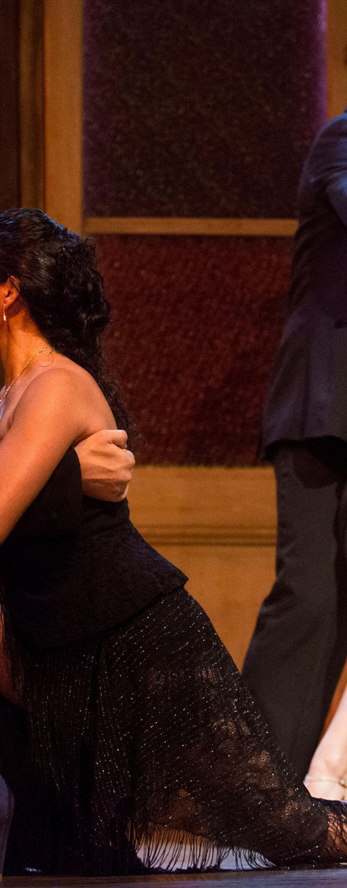 Elegant tango dancers in dramatic pose