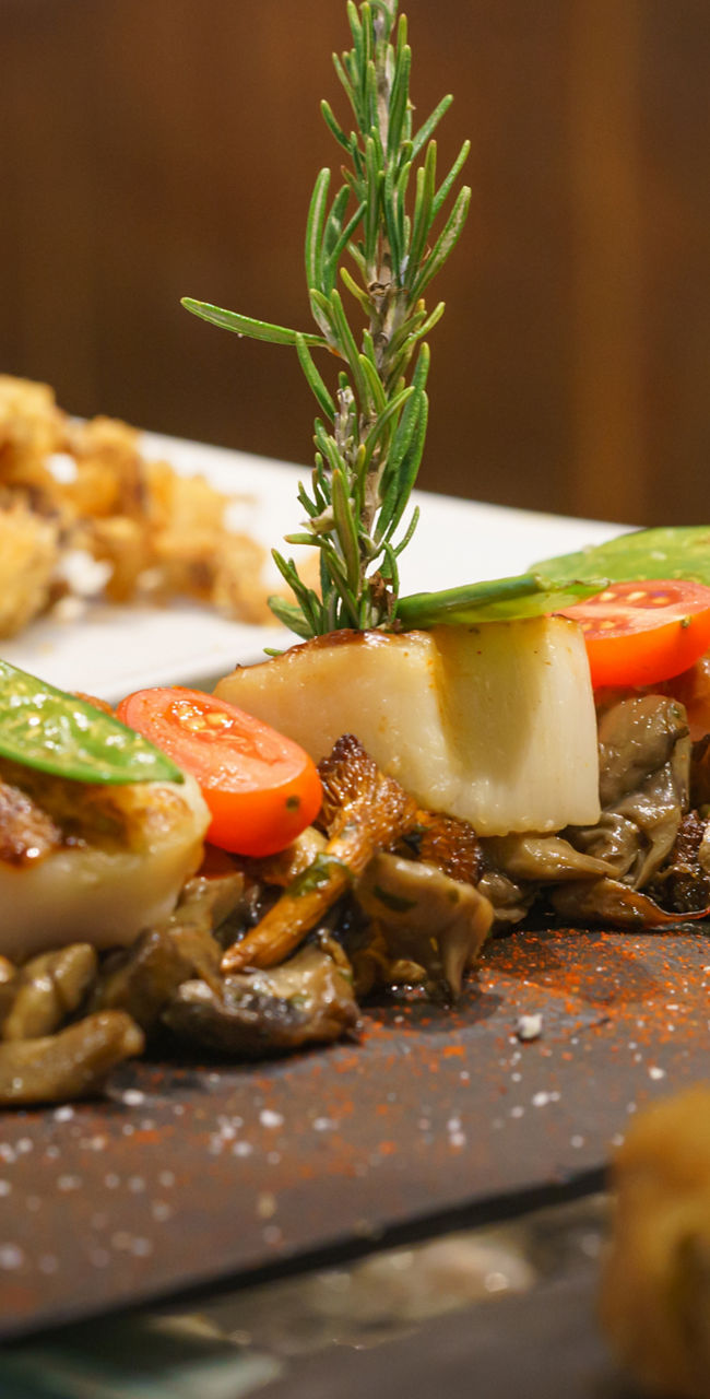 Gourmet seafood platter with rosemary garnish