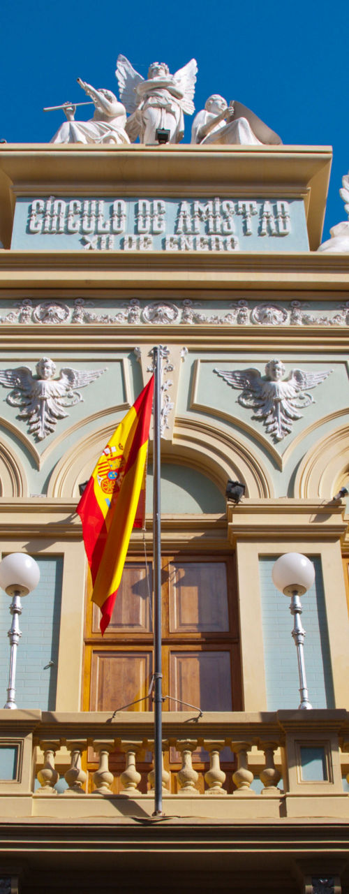 Historic building with flags and ornate facade