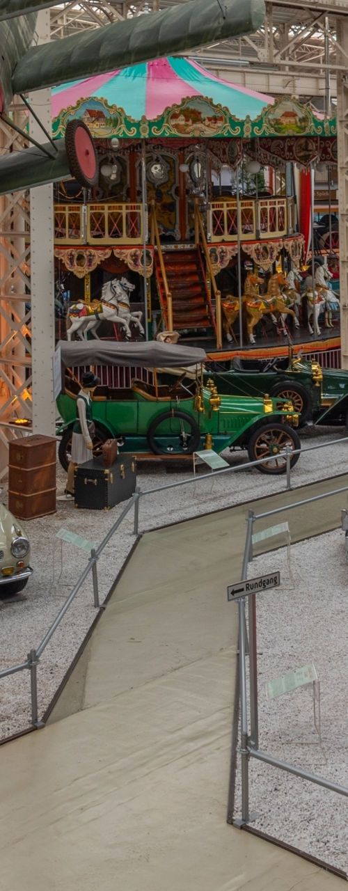 Vintage vehicles and aircraft in museum exhibit