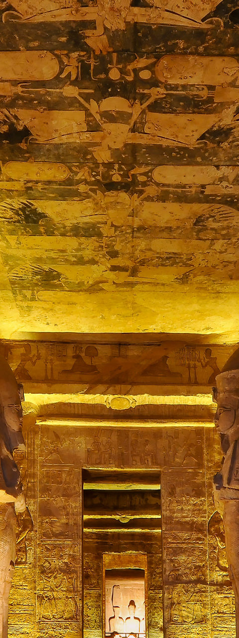 Ancient Egyptian temple interior with statues