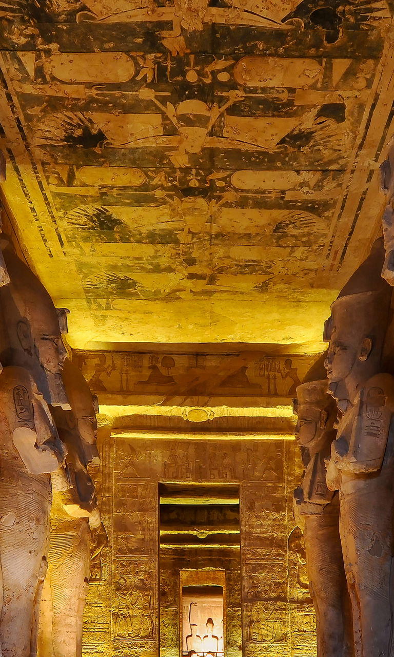 Ancient Egyptian temple interior with statues
