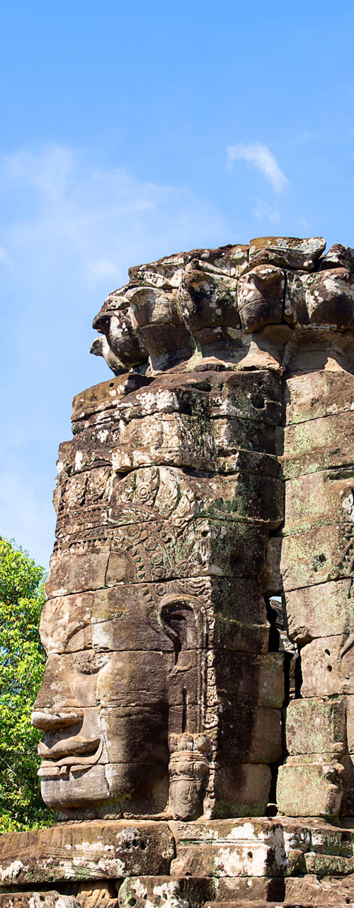 Ancient stone temple with carved faces
