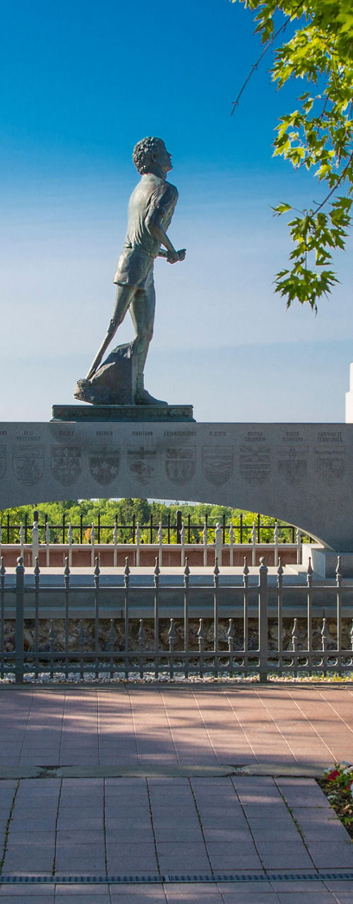 Historic statue overlooking scenic waterfront