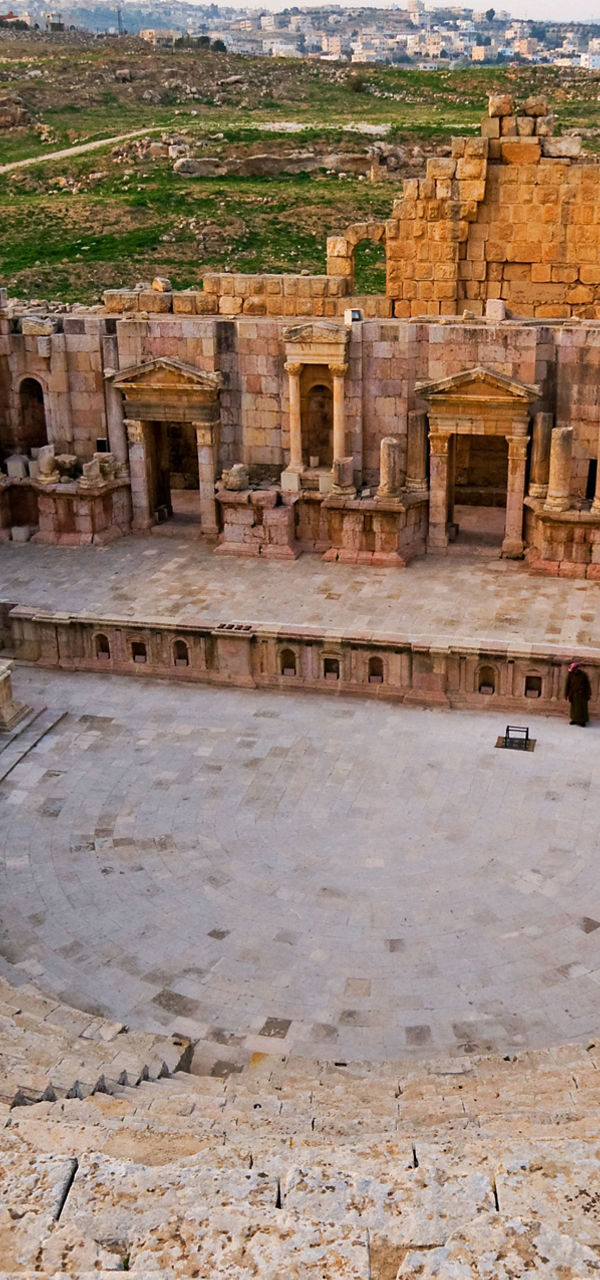 Ancient Roman amphitheater in scenic landscape