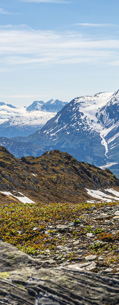 Snow-capped mountains under clear blue sky