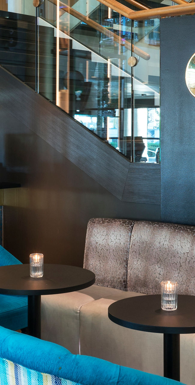 Modern lounge with vibrant seating and bar