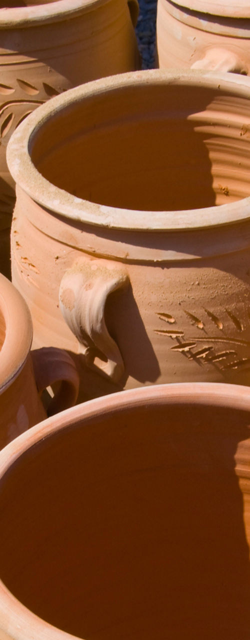 Terracotta pots in sunlight, rustic design