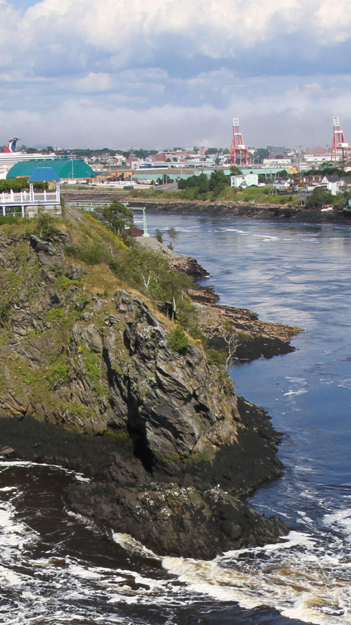 Scenic river view with bridge and cityscape