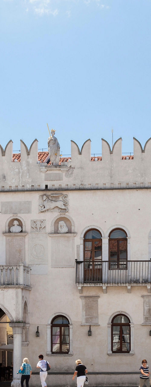 Historic Venetian Gothic palace in sunny square