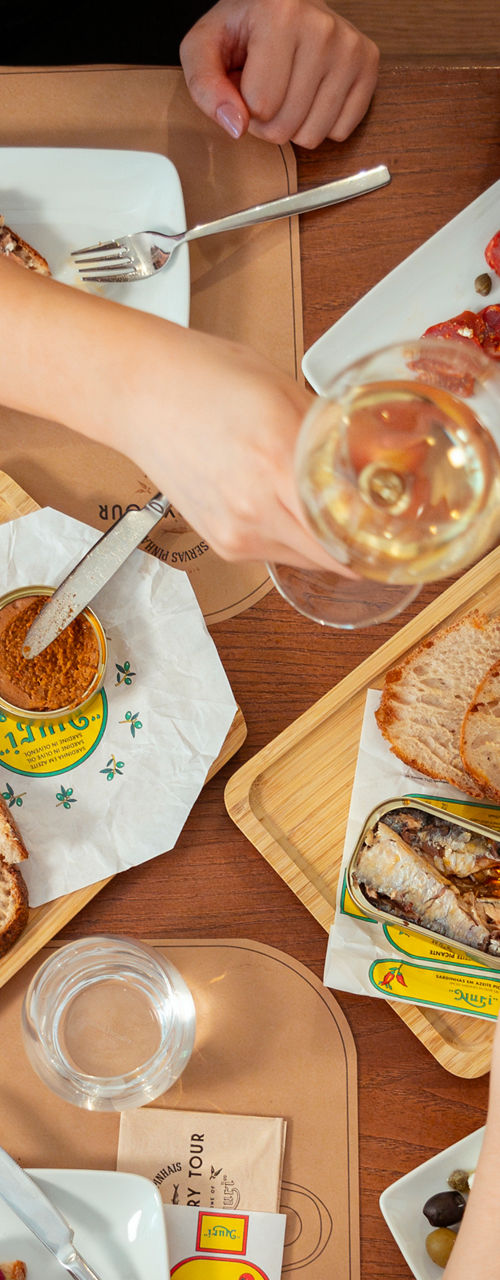 Group toasting over canned seafood meal