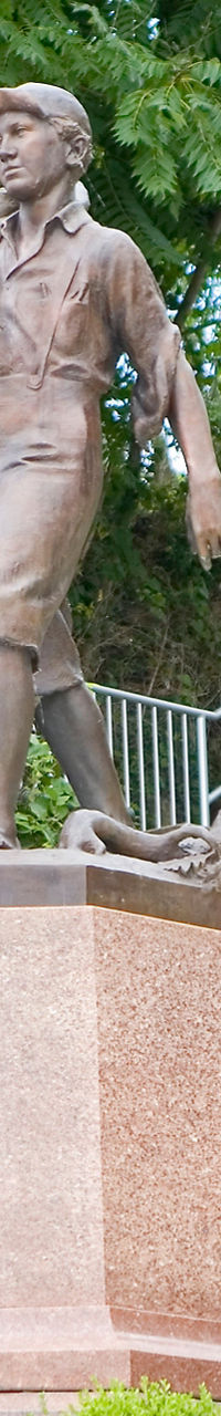 Bronze statue of two young boys outdoors