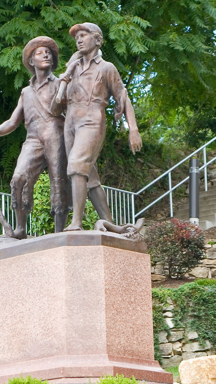 Bronze statue of two young boys outdoors