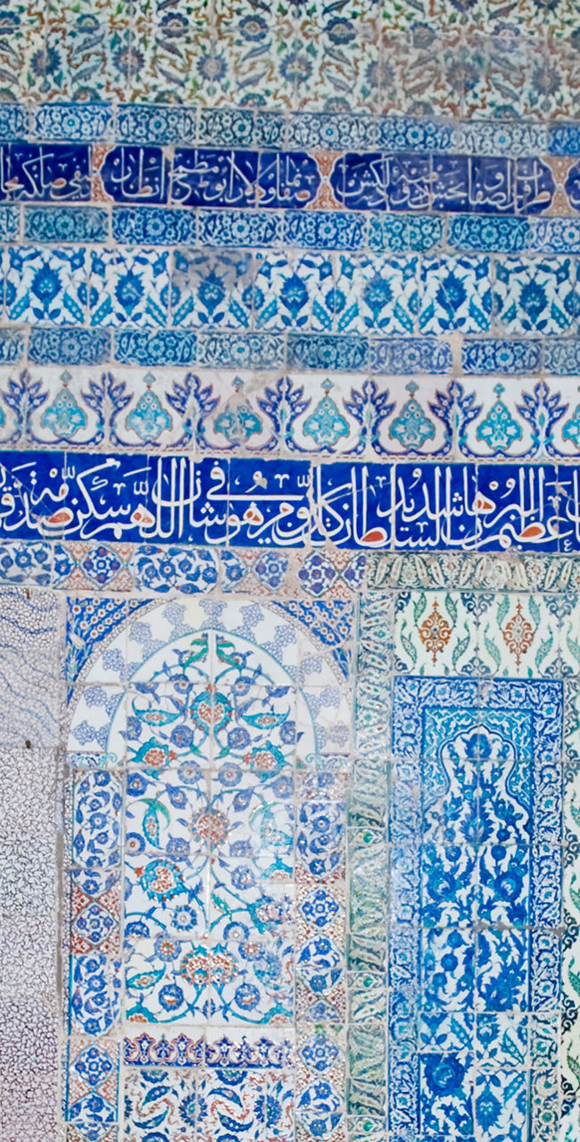 Intricate blue tile wall in historic setting