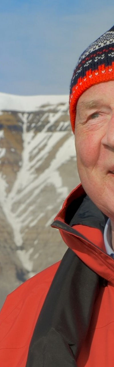 Person in red jacket in snowy mountains