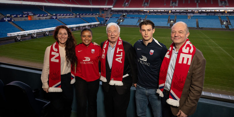 Group at a Soccer Stadium with Scarves