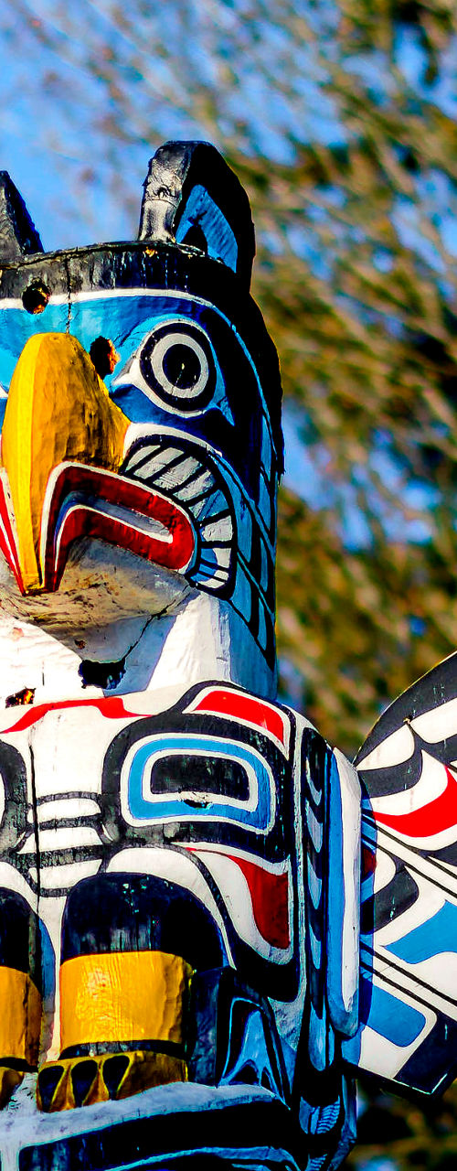 Colorful totem pole with bird design outdoors