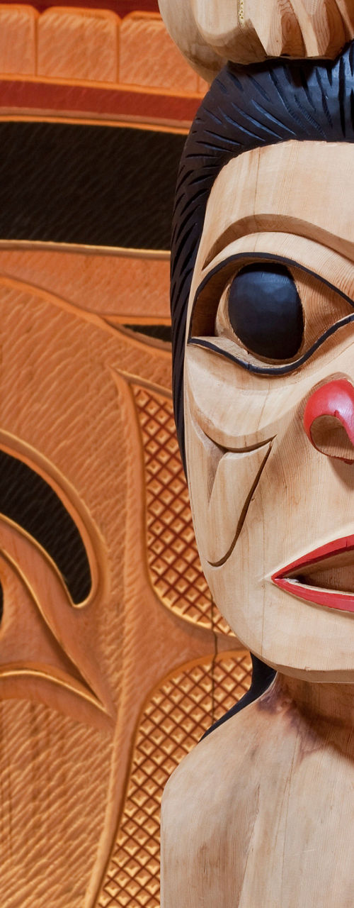 Traditional wooden totem pole carving details