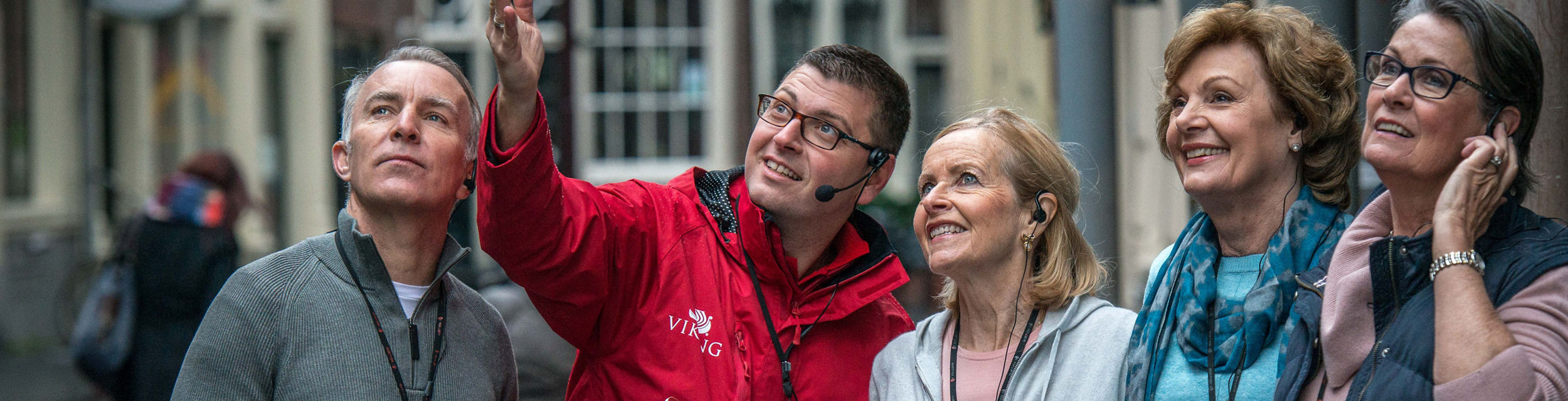 Tour guide with group in urban setting