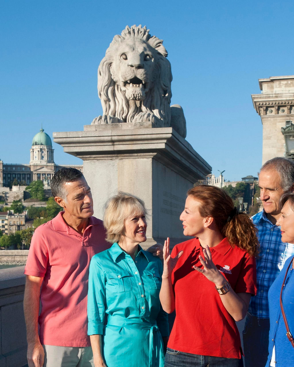 Group sightseeing near historic bridge in Budapest