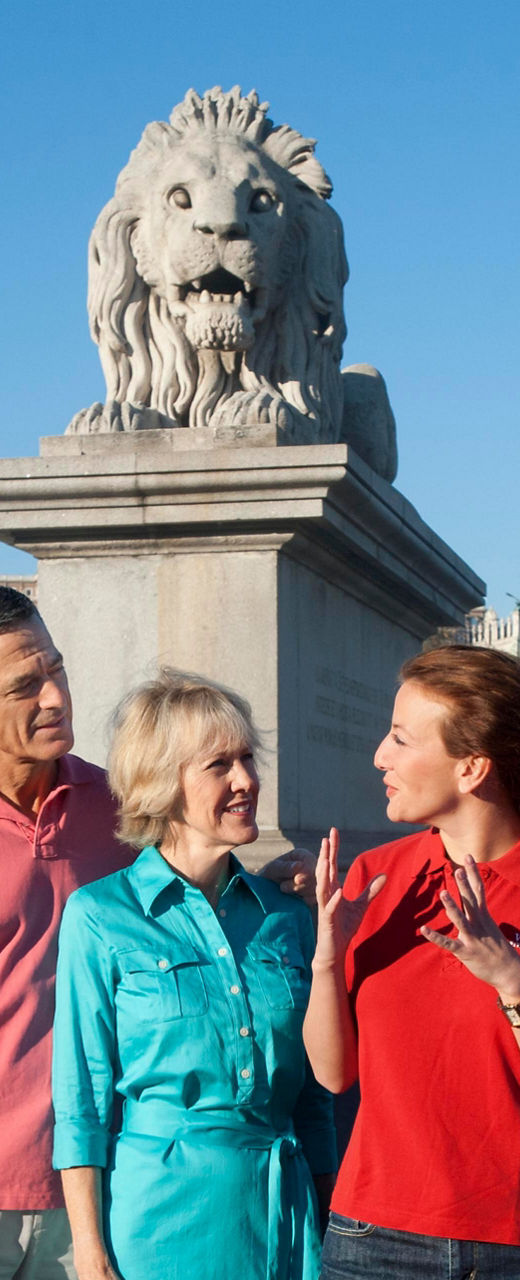 Group sightseeing near historic bridge in Budapest