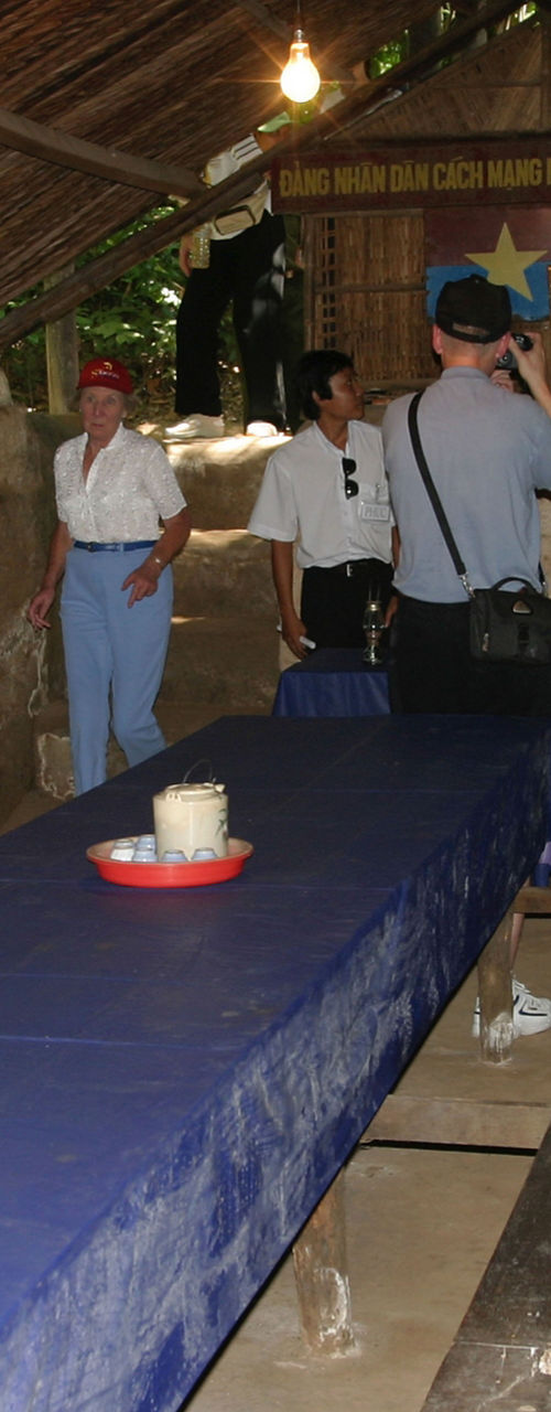 Tourists exploring historical underground shelter